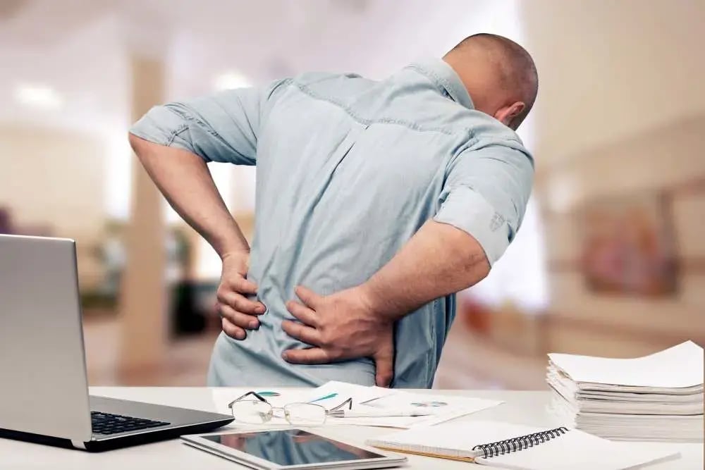 business-man-with-back-pain-sin-office-pain-relief-concept